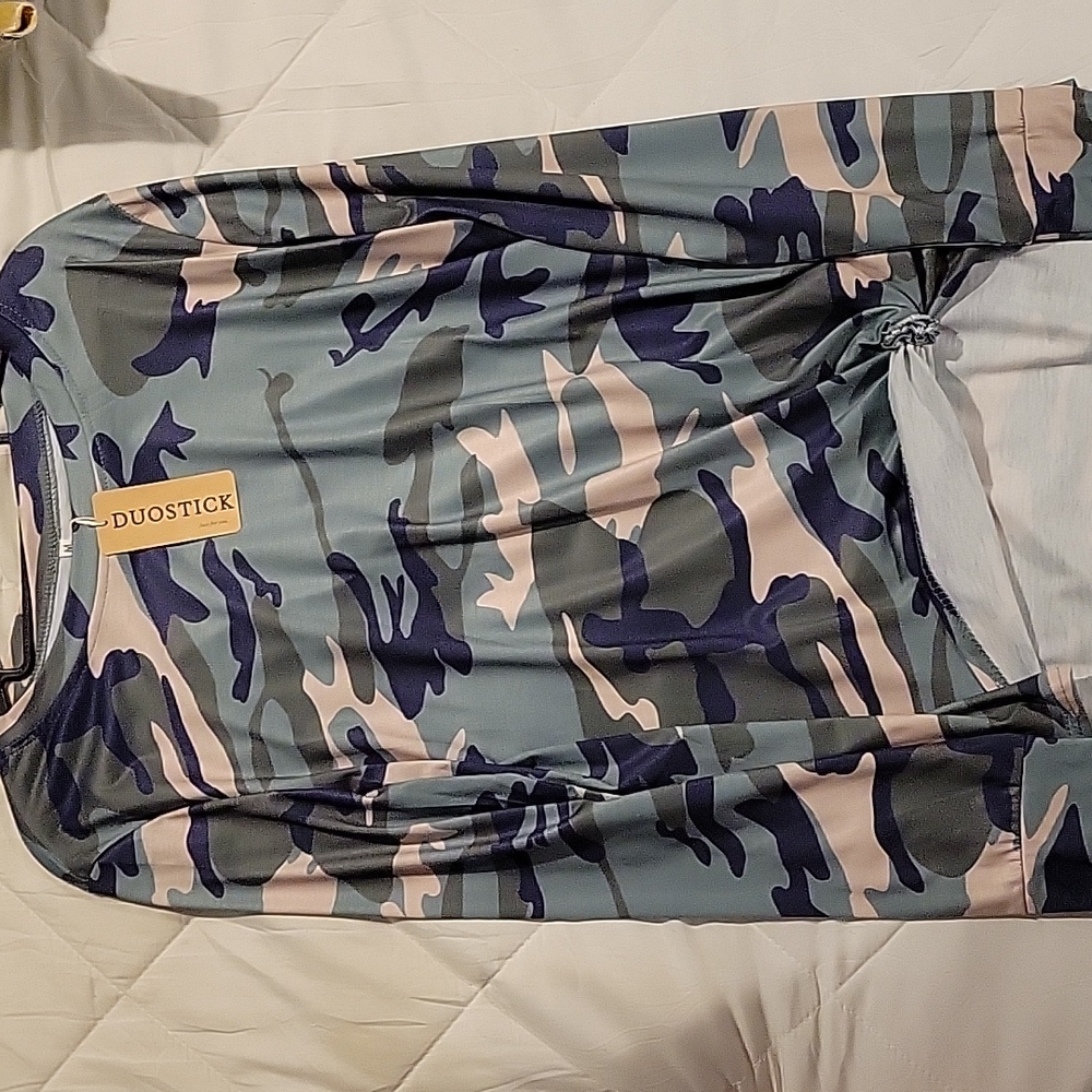 Long-sleeved, medium camo shirt.